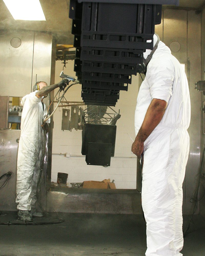 spraying product as it enters oven