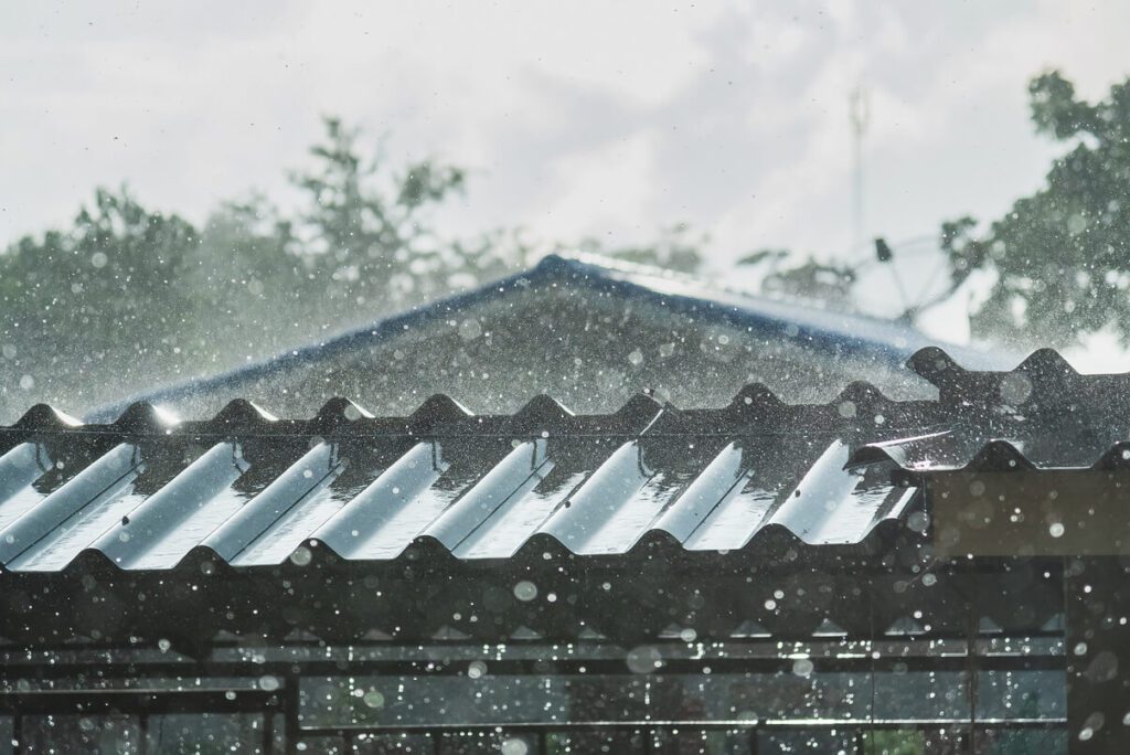 Rain beating down on a metal roof.