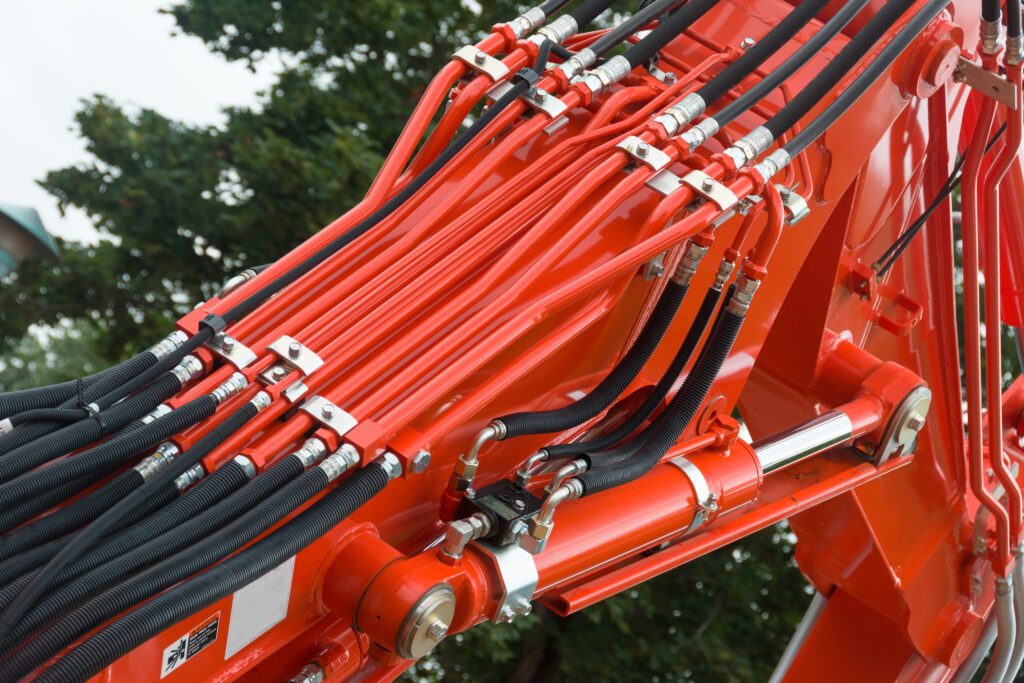 Red hydraulics on machinery.