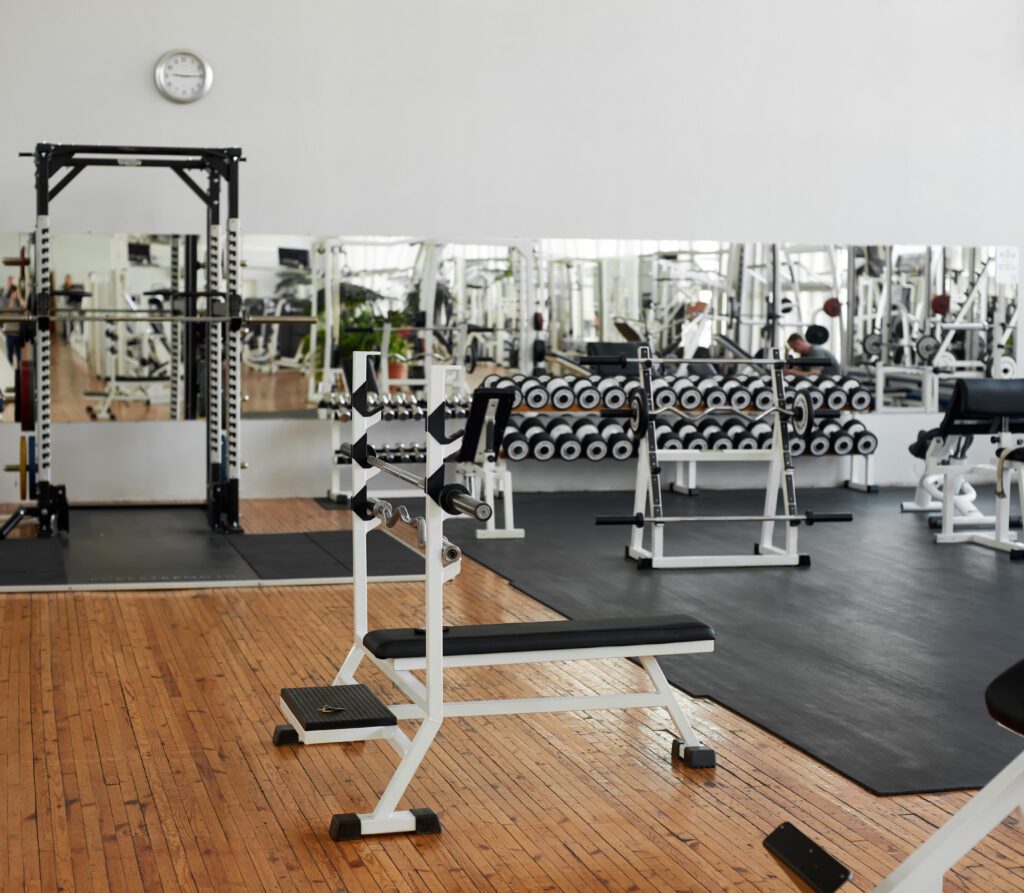 Modern fitness center with training equipment.