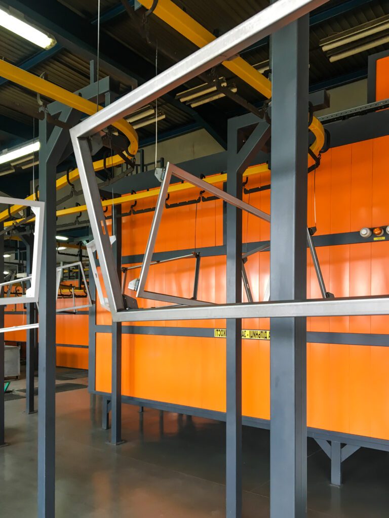 Aluminum frames hanging for coating.
